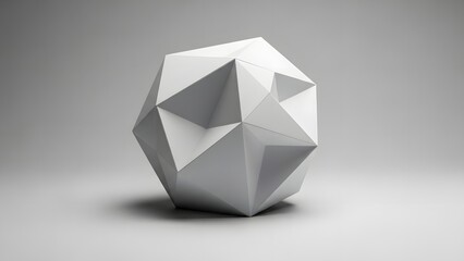 A white geometric polyhedron sits on a gray background with a subtle shadow underneath it
