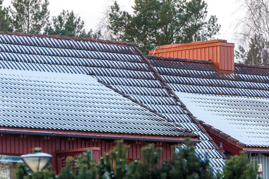 Snow covered tiled rooftops in winter