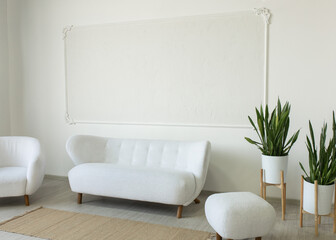 Minimalist Scandinavian living room with white boucle sofa and armchair