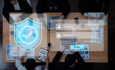 Diverse professionals engaged in a business meeting around a table, featuring a security login interface with data analytics graphics, emphasizing teamwork and technology. Gantry