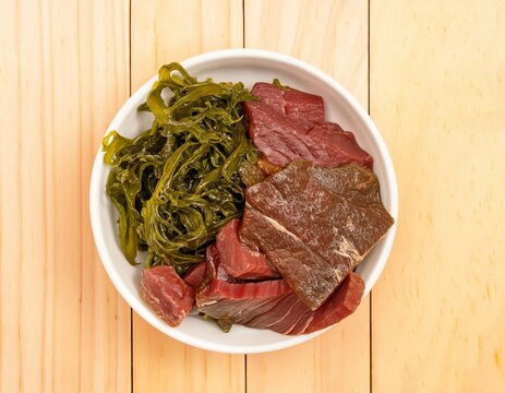Raw hida beef and wakame seaweed ingredients