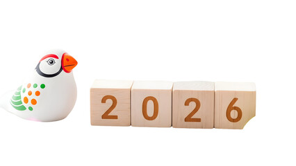 Decorative bird figurine beside 2026 blocks