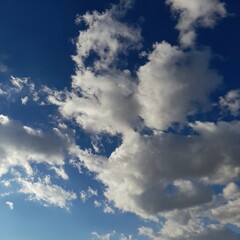 Fluffy White Cumulus Clouds in the Blue Sky