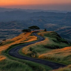 Winding road through golden hills at sunrise