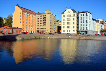 Fototapeta premium Pohjoisranta is located in center and runs along northern harbor of Helsinki Finland. On waterfront there are houses built in different architectural styles in different historical periods