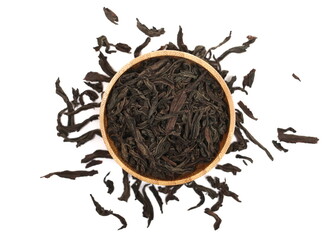 Dry leaves Oolong tea in bamboo bowl, Camellia sinensis, dark green leaves isolated on white, top view