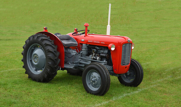Red Massey Ferguson 35 utility tractor parked on grass