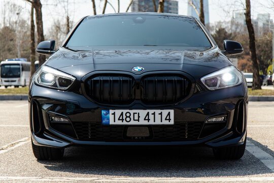 April 7, 2024, Seoul, South Korea - Front view of a black BMW 118d MSP car parked outdoors