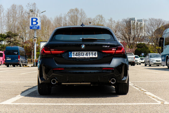 April 7, 2024, Seoul, South Korea - Black BMW 118d parked in an outdoor parking lot