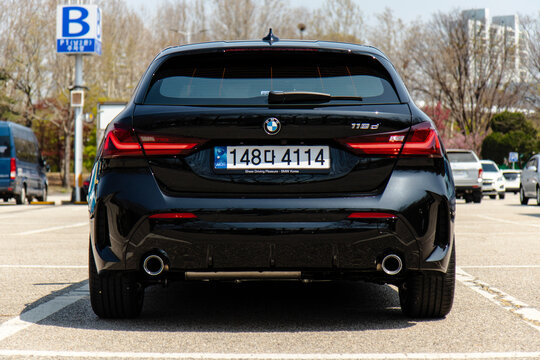 April 7, 2024, Seoul, South Korea - Rear view of a black BMW 118d MSP hatchback parked in an outdoor lot