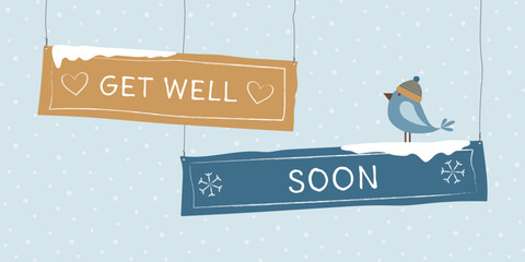 Get well soon - Schriftzug in englischer Sprache - Gute Besserung. Winterliche Gru&szlig;karte mit beschrifteten Schildern und einem Vogel mit Pudelm&uuml;tze vor einem Schneehintergrund.