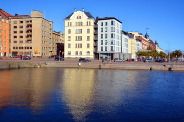 Fototapeta premium Pohjoisranta is located in center and runs along northern harbor Helsinki Finland. On waterfront there are houses built in different architectural styles in different historical periods