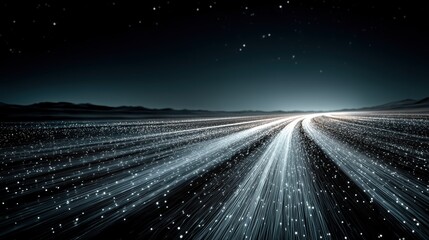 Vast landscape of glowing fiber optic lines under starry night sky for global network concepts.

