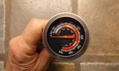 closeup of an outdoor grill thermometer