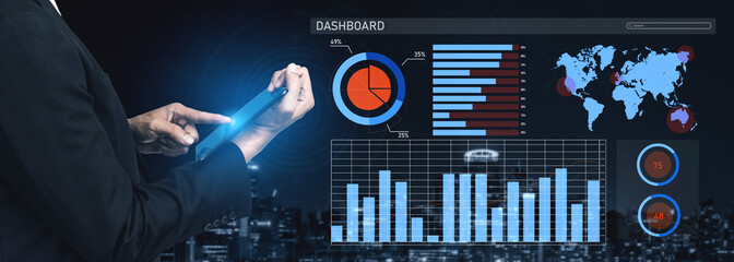 A business professional utilizes a modern digital dashboard to analyze data and metrics amidst a vibrant city skyline, showcasing technology in action. Impute