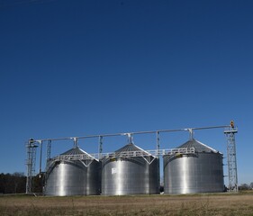 grain silos in the field with  clear skies © bybarn