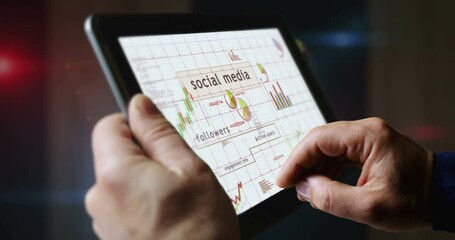 Social media charts and graphs diagram on touchscreen pad display. Finger touch tablet screen in hand. Digital analysis and report. - Powered by Adobe