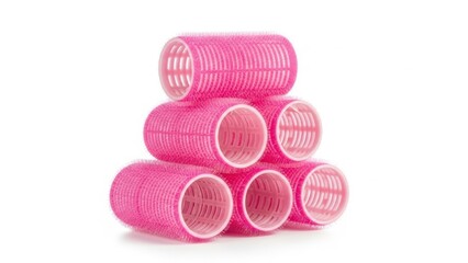 Obraz premium Stack of pink hair rollers