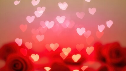 Abstract festive background featuring a bright bokeh pattern of glowing pink heart shapes floating above blurred red roses