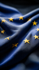 Waving European Union flag with golden stars symbolizing unity, democracy, and European identity.

