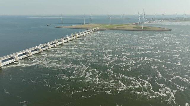 Wind farm and flood barrier (Oosterscheldekering) on the coast of the Netherlands