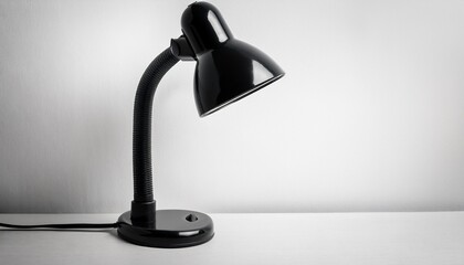 black adjustable desk lamp against white background