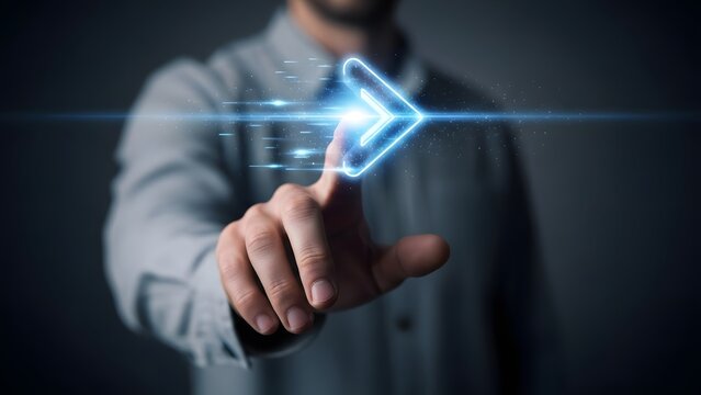 Human hand interacts with a glowing blue digital arrow icon, symbolizing future technology, progression, and user interface innovation - Powered by Adobe