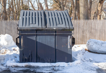 large commercial dumpster outdoor after snow