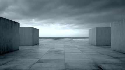 Gray Concrete Cubes Under Overcast Sky Near Horizon Ocean View With Harsh Shadows and Texture in Exterior Setting