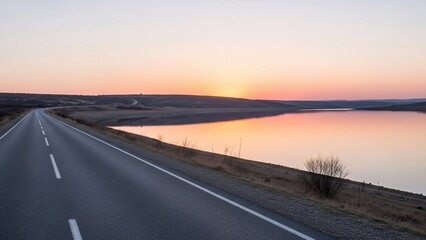 Scenic Highway Reflecting Sunset Over Calm Water Landscape.