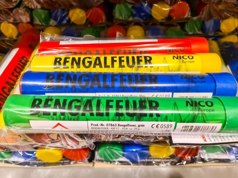 Kiel, Germany - 29. December 2025: Bengalfeuer fireworks in red yellow blue green colors
