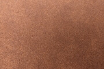 Brown leather texture background with natural grain for upholstery design.