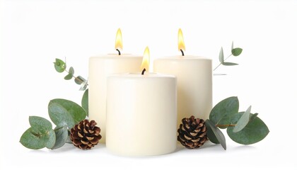Three lit candles adorned with eucalyptus leaves and pinecones creating a serene and peaceful ambiance