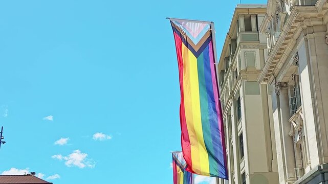 Progress pride flag hanging from building in New Zealand