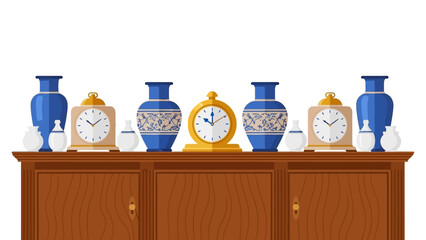 Elegant arrangement of ceramic vases and clocks on wooden cabinet