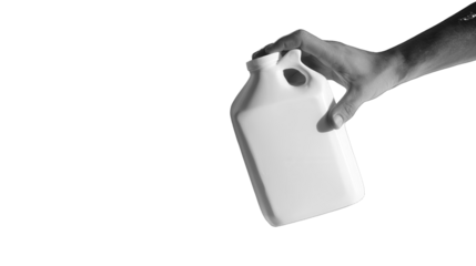 Hand holding a white plastic jug isolated on a transparent background 1