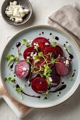 Fresh beets with creamy yogurt and crushed pistachios served in a warm dish