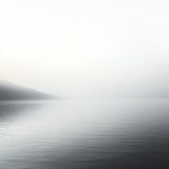 Misty calm lake with distant hillside shoreline and soft gray sky, serene minimalist atmosphere with gentle ripples