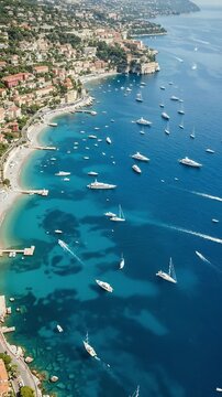 Aerial View Of A French Riviera Town With Blue Waters And Many Boats