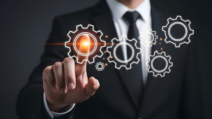 Businessman interacting with glowing gear icons in a digital interface