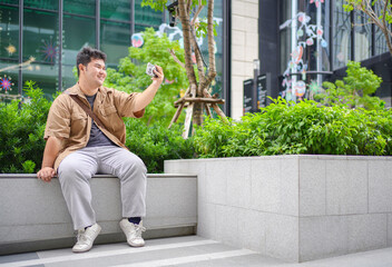 This composition balances modern glass architecture with focused digital communication in a professional context.