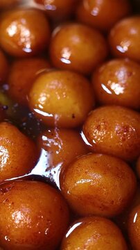 Gulab jamun or kaala jam indian dessert fried balls dipped in sugar syrup