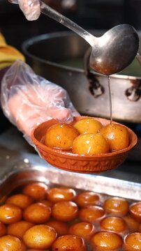 Gulab jamun or kaala jam indian dessert fried balls dipped in sugar syrup