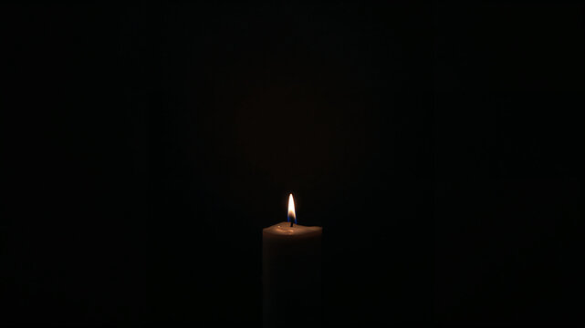 Candle in the Darkness: A lone candle, its flame flickering gently against a black canvas, casts a warm, inviting glow, creating a poignant ambiance.