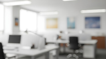 Bright and airy open plan office space with blurred figures working at desks during the day.