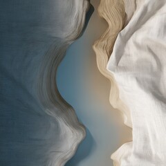 Abstract landscape formed by textured beige and white cliffs bordering a serene blue body of water in soft daylight