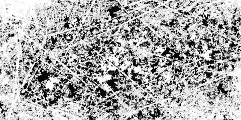 An abstract black and white texture displaying a chaotic network of lines and mottled areas resembling distressed material