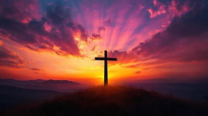 Wooden cross silhouette on a grassy hill at dramatic sunset, radiant golden and purple sky with sun rays and distant mountain ridges, inspiring peaceful reverence