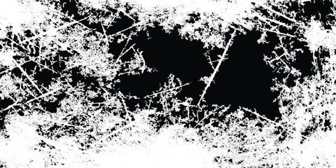 A stark black and white abstract image featuring jagged fractured lines and a central dark void