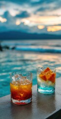 Two refreshing cocktails, adorned with fruit, sit by a poolside at sunset, showcasing a beautiful blend of colors and a tranquil ambiance.